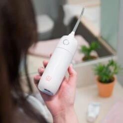 Spotlight Oral Care Water Flosser -Care Product Store SOC Water Flosser 2000x2000Lifestylle 01 11dd96daa3fc8c5e1119bc3ea0940038